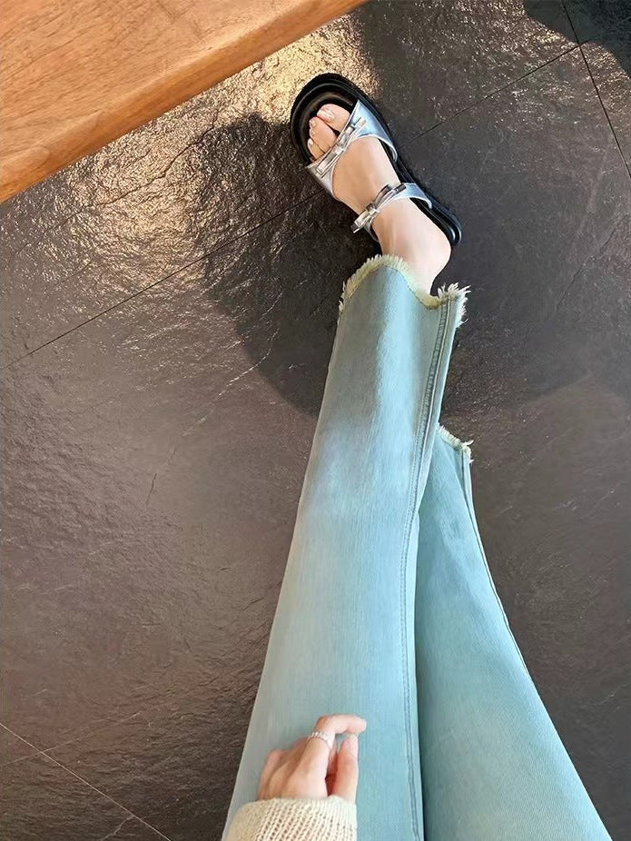 A slipper, flip flop, slides, with bows and ribbons