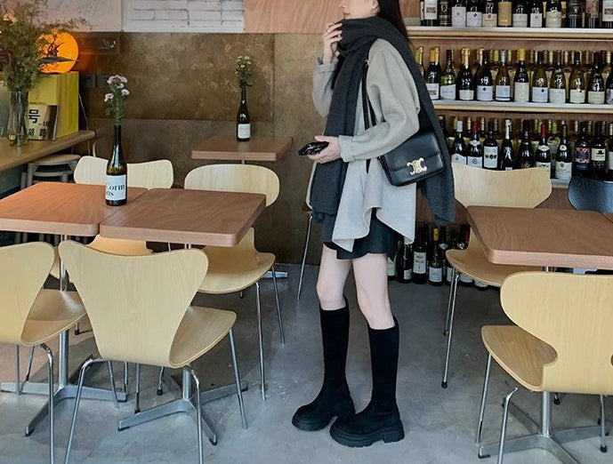 A Girl wearing Suede Muse Boots - Black Below The Knee Boots Side View